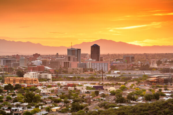 Tucson, Arizona, USA downtown city skyline with mountains at twilight.