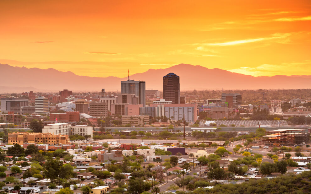 Tucson, Arizona, USA downtown city skyline with mountains at twilight.